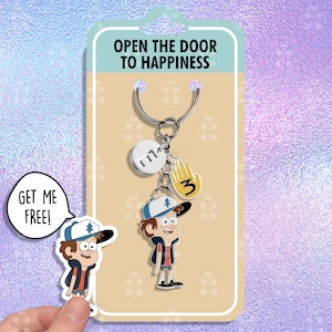 Puede incluir: Un llavero con un personaje de dibujos animados del programa Gravity Falls. El llavero tiene un anillo de metal, un dije con las iniciales del personaje, un dije con una mano y un dije con el número 3. El llavero está empaquetado en una tarjeta que dice "Abre la puerta a la felicidad".