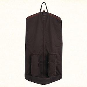 Handcrafted leather suit carrier, designed for travelers. A versatile garment bag for suits, weddings, and stylish gifts, made from premium leather for durability and elegance.