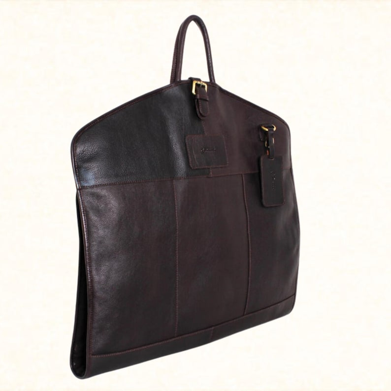 Elegant leather suit travel bag, handmade for durability. Perfect for suits, hanging garments, and groomsmen gifts, blending style and practicality for modern travelers.
