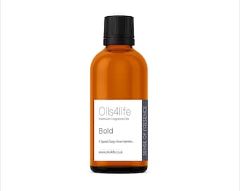 May include: A brown glass bottle with a black cap, labelled "Oils4life" and "Bold." The label also includes the text "Premium Fragrance Oils" and "A Spanish Design House Inspiration..." The bottle contains a golden liquid.