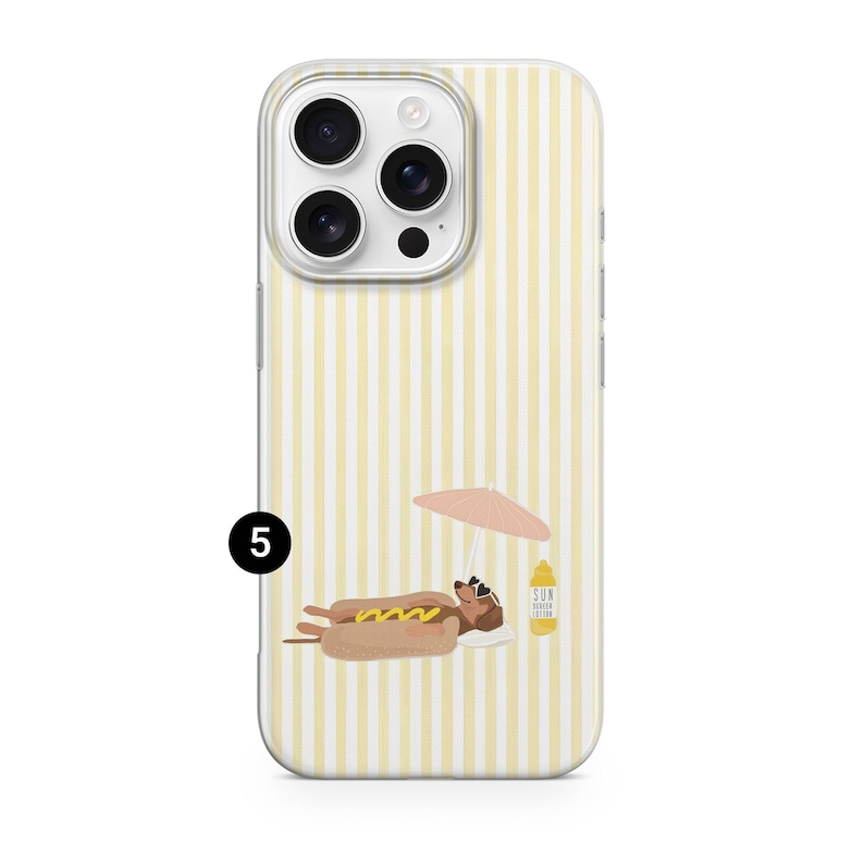 May include: A phone case with a yellow and white striped background. The case features a cartoon hot dog wearing sunglasses and relaxing under a pink umbrella. A bottle of sunscreen is also visible.