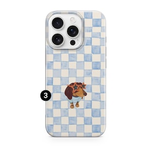 May include: A clear phone case with a blue and white checkered pattern. The case features a dachshund wearing star-shaped sunglasses and a blue and white striped shirt. The number 3 is printed in black on the bottom left.