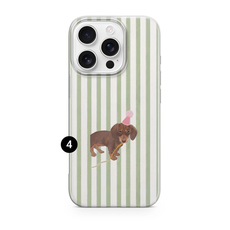 May include: A clear phone case with a vertical green and white striped pattern. The case features a watercolor illustration of a brown dachshund wearing a pink party hat and holding a yellow stick.