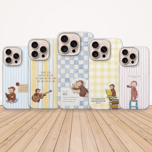 May include: Five phone cases with cartoon monkey designs. The cases feature various patterns, including stripes, gingham, and text from Psalms. The monkey illustrations depict different scenes, such as playing guitar and reading books. The cases are in shades of blue, yellow, and pink.