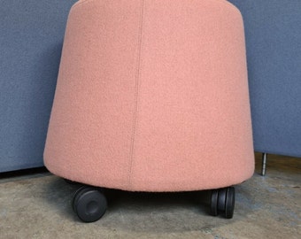 Mobile upholstered office stool made by Orangebox