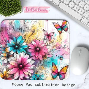 May include: A rectangular mouse pad featuring a floral and butterfly design. The design includes pink, blue, and yellow flowers, along with colorful butterflies. The text "Mouse Pad sublimation Design" is at the bottom.