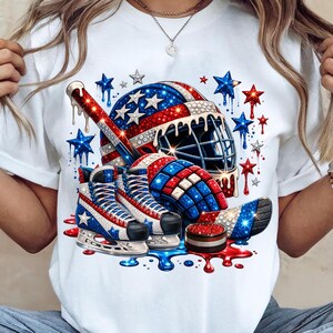 Patriotic Hockey Shirt Design featuring bold red white and blue ice skates, helmet and puck artwork. Perfect for hockey moms, sports fans, and 4th of July celebrations. High resolution graphic ideal for sublimation, DTF printing, and DIY hockey fan apparel projects