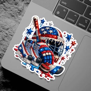 Patriotic Hockey Sticker Design with red white blue helmet, skates and puck artwork. Perfect for water bottles, laptops, tumblers, scrapbooking and sports fan decals. High resolution printable graphic for hockey lovers and USA themed projects.