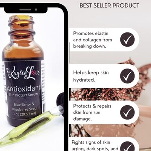 May include: A 1 ounce (29.57 ml) bottle of Kaylee Love Antioxidant Skin Protect Serum with a dropper. The bottle is clear glass with a black label and white text. The label says "Kaylee Love Antioxidant (Skin Protect Serum) Blue Tansy & Raspberry Seed 1 oz (29.57 ml)". The bottle is sitting on a white surface. The image also includes a list of benefits of the serum, including promoting elastin and collagen, keeping skin hydrated, protecting from sun damage, and fighting signs of aging.