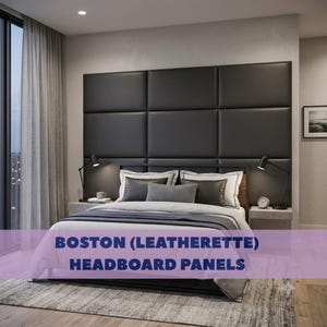 May include: A set of rectangular black leatherette headboard panels arranged in a grid pattern behind a bed. The panels feature a smooth, matte finish and are mounted on the wall, extending horizontally across the width of the bed frame.