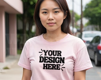 May include: A pink t-shirt with the text "YOUR DESIGN HERE" printed in black.