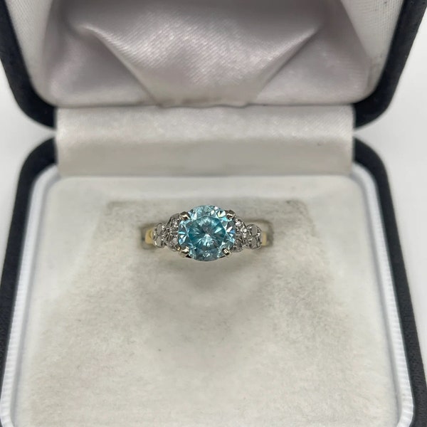 18ct gold blue zircon and diamond ring