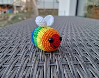 Crocheted rainbow bee