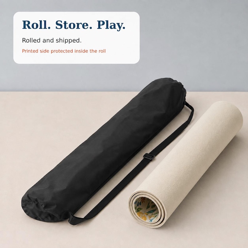 May include: A black cylindrical carrying case with an adjustable shoulder strap and a rolled beige mat with a floral pattern visible on the inner edge. The text "Roll. Store. Play. Rolled and shipped. Printed side protected inside the roll" is visible.