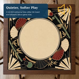 May include: A square mahjong table mat featuring a central beige circle surrounded by a black border with decorative bamboo stalks, red and cream folding fans, and small circles. The text reads: Quieter, Softer Play, 4 mm EVA cushioning.