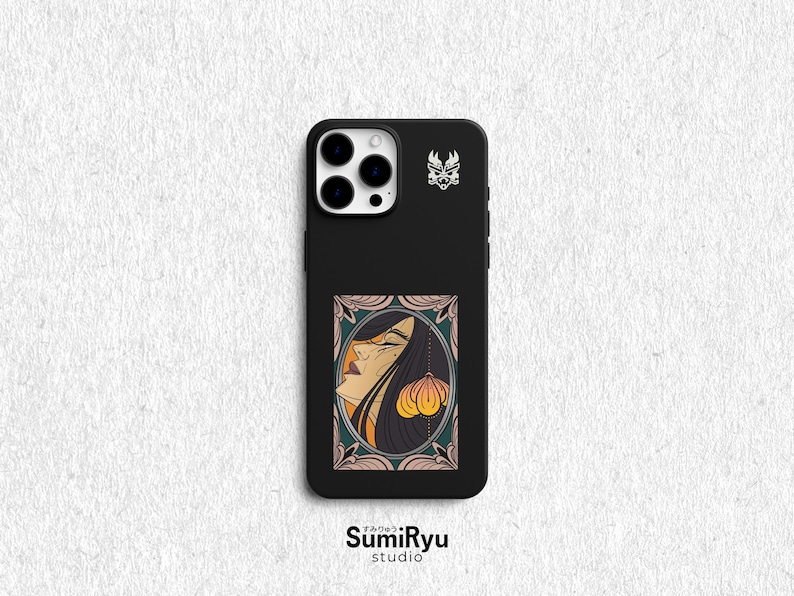 May include: Black phone case with a graphic of a woman with long black hair and a yellow flower. The case has a black background and a white border around the graphic. The phone case has a camera lens cutout and a logo that says "SumiRyu studio".