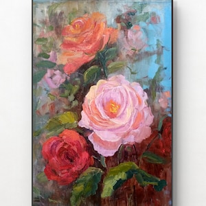 May include: An oil painting of roses in shades of pink, red, and orange, with green leaves. The artwork is framed in a black frame and set against a light blue background.