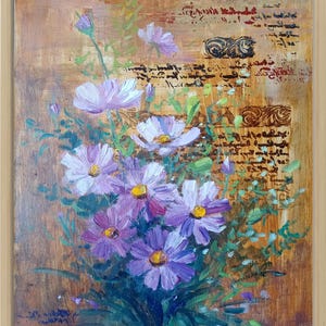 May include: Oil painting of a bouquet of purple and white flowers with yellow centers. The flowers are set against a textured brown background with script and decorative elements. The artwork is framed in a light wood frame.