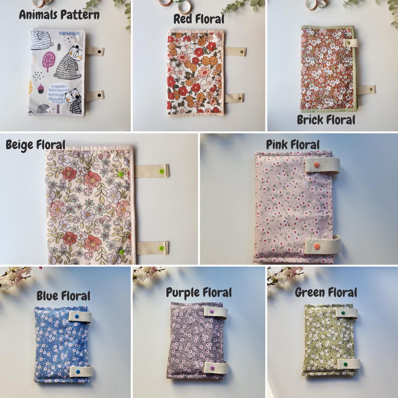 May include: A collection of fabric book covers with various patterns. The covers include an animal pattern, red floral, brick floral, beige floral, pink floral, blue floral, purple floral, and green floral designs. Each cover has a strap closure.