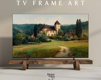 Op de afbeelding: Een groot flatscreen-tv-toestel met een landschapsschilderij van een Europees kasteel met een rood dak, geplaatst op een rustieke houten standaard. De afbeelding is voorzien van het label "4K HI-RES TV FRAME ART" en het logo "Mossy Hollow Farm".