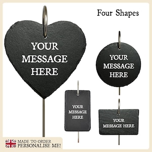 May include: Four slate signs with metal rings and stakes, each with the text "YOUR MESSAGE HERE" in a different shape: heart, circle, rectangle, and square.