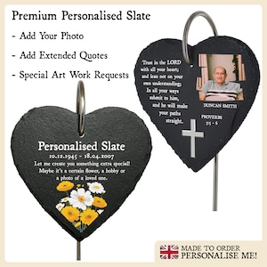 May include: A black heart-shaped slate plaque with a personalised message, dates, and a floral design. The plaque is attached to a metal stake and can be used as a memorial or garden marker. The text on the plaque reads: "Personalised Slate 10.12.1945 - 18.04.2007 Let me create you something extra special! Maybe it's a certain flower, a hobby or a photo of a loved one."