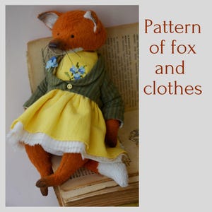 May include: A plush fox toy with orange fur, wearing a yellow dress with a blue floral embroidery, a green striped jacket with a single button, and white trim. The text Pattern of fox and clothes is visible on the right side of the image.