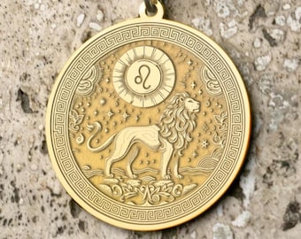 May include: Gold-colored pendant necklace featuring a detailed Leo zodiac symbol. The round pendant showcases a lion and the Leo symbol within a decorative border. The necklace is on a gold chain.