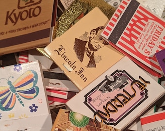 May include: A collection of vintage matchbook covers with various designs. Some of the covers feature images of a butterfly, a bar, and a restaurant. The text on the covers includes "Kyoto", "Lincoln Inn", "Friday's", "Yesterday", and "Restaurant & Lounge".