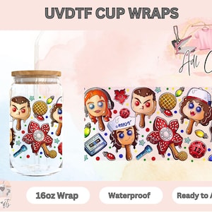 May include: A clear glass cup with a wooden lid, wrapped with a colorful design featuring cartoon characters and a red flower. The words "UVDTF CUP WRAPS" are at the top. The wrap is 16oz and ready to apply.