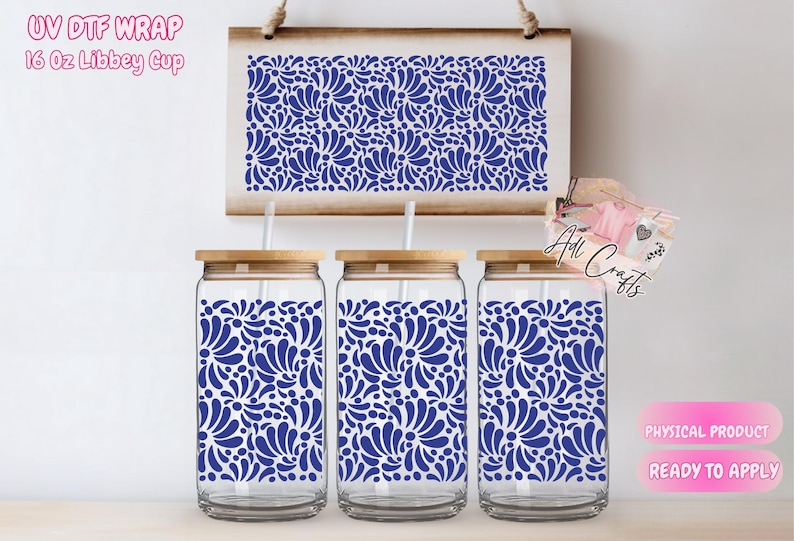May include: Three 16 ounce glass cups with wooden lids and blue floral patterned designs. The cups are ready to apply with a UV DTF wrap.