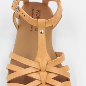 Closed toe fisherman sandals from natural leather with criss cross thin leather straps and a big strap in the middle from toes to ankle strap. Greek leather sandals can used for working or walking.