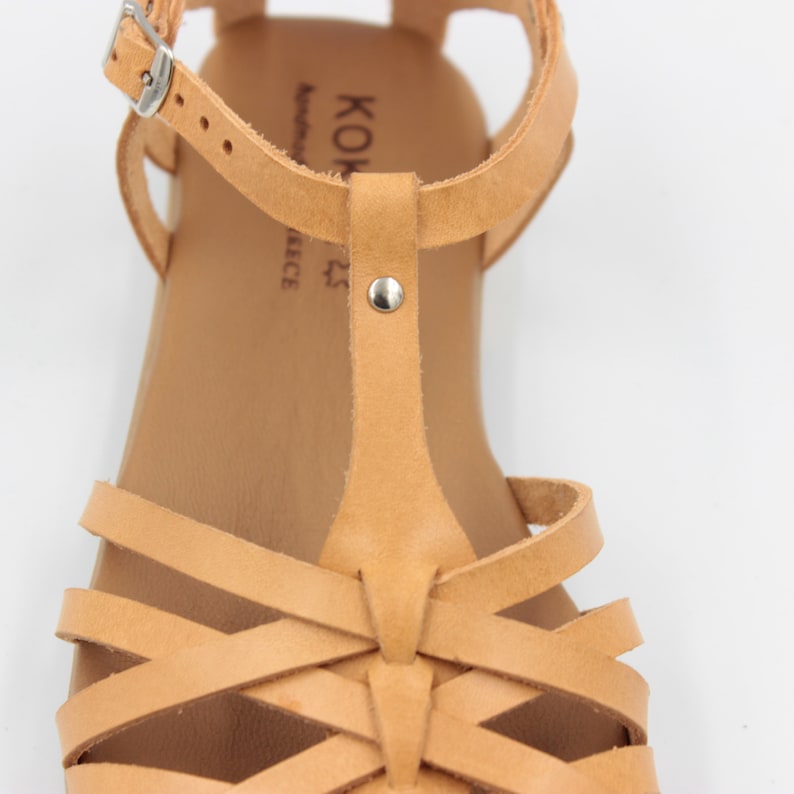 Closed toe fisherman sandals from natural leather with criss cross thin leather straps and a big strap in the middle from toes to ankle strap. Greek leather sandals can used for working or walking.