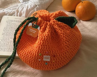 Schema per realizzare una borsa arancione all'uncinetto (taglia grande, circa 18 x 15 cm)