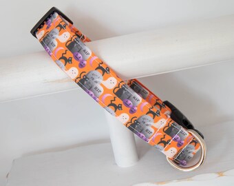 May include: Orange dog collar with a Halloween print featuring black cats, ghosts, pumpkins, and tombstones with the text "RIP".