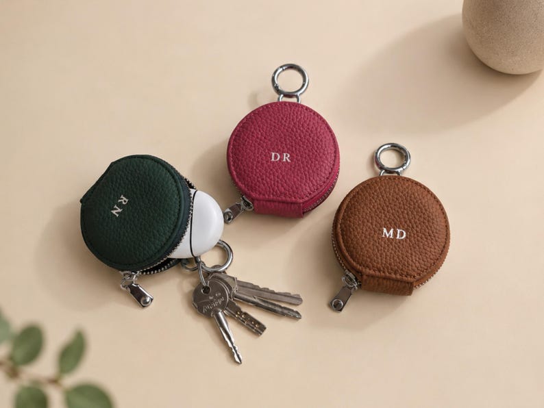 Ear buds keyholder in pink, brown and green.