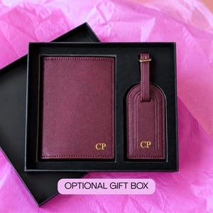 Set of burgundy passport book and luggage tag with gold initials CP in a black gift box. Also comes in black, navy, khaki, brown, dark green, purple, pink, blue and blush. Comes with optional gift box set.