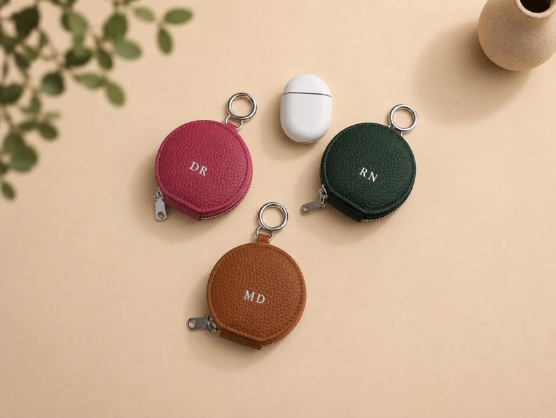 Berry pink, green or brown circular zipper pouch.