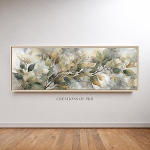 Könnte beinhalten: Ein panoramisches Wandbild in einem hellen Holzrahmen mit einem Aquarellgemälde von botanischen Zweigen mit grünen und goldbraunen Blättern sowie weißen Blüten vor einem weichen grauen Hintergrund. Der Text CREATIONS OF PKB ist unten zu sehen.