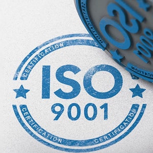 May include: A blue rubber stamp with the text "ISO 9001" and the word "CERTIFICATION" repeated around the edge.