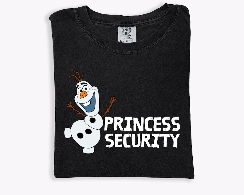 May include: Black t-shirt featuring a cartoon image of Olaf the snowman with the text "PRINCESS SECURITY" in white. The shirt is folded and has a Comfort Colors tag at the top. The design is centered on the front of the shirt.