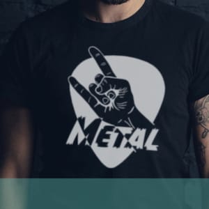 May include: A black t-shirt featuring a white guitar pick design. The pick depicts a hand making the rock and roll sign with the word "METAL" written on it.