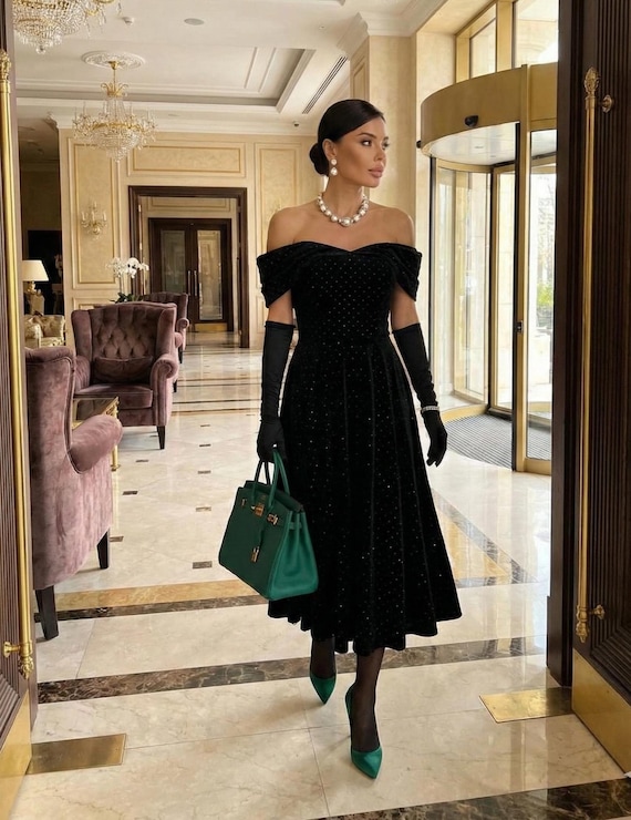 Black cocktail dress -- off shoulder velvet midi with sparkly stones