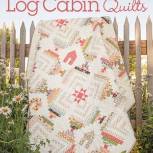 May include: A book titled "Creative Log Cabin Quilts" with a quilt on the cover. The quilt is made in a log cabin pattern with a variety of colors and fabrics. The book is from Annie's Quilting and features 10 fresh new designs.
