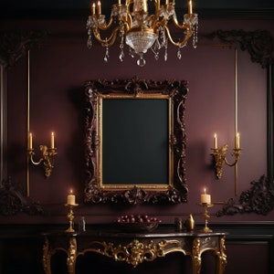 May include: A dark wood console table with ornate gold accents and a black marble top. The table is decorated with two candlesticks, each holding a lit candle, and a bowl of red apples. A large, ornate gold frame with a black background hangs on the wall behind the table.