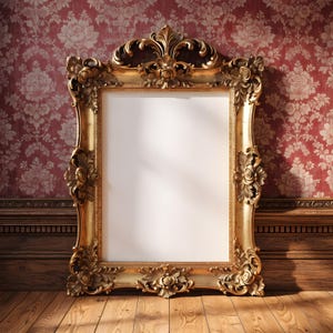 May include: A rectangular mirror featuring an ornate gold-colored frame with intricate floral and scrollwork carvings. The frame displays detailed relief patterns along the edges and a prominent decorative crest at the top center.