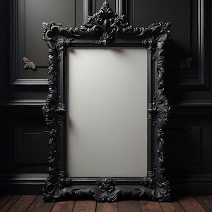 May include: A large, ornate black picture frame with a white background. The frame has intricate carvings and a distressed finish.