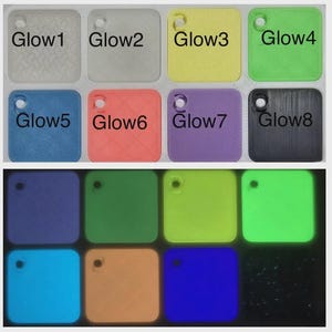 May include: A collection of square, color-coded tags labeled "Glow1" through "Glow8". The tags are in various colors including white, yellow, green, blue, orange, purple, and black. The bottom row of tags glows in the dark, showcasing the luminous effect.