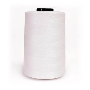 May include: A large spool of white thread with a black top. The thread is tightly wound, creating a cylindrical shape. The image is a close-up shot against a white background, highlighting the texture and color of the thread.