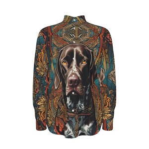 May include: A long-sleeved button-down shirt with a colourful, intricate pattern featuring a brown and white dog's head in the centre.